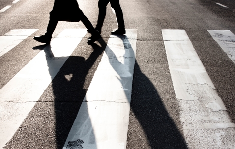 pedestrian crosswalk, people crossing a road